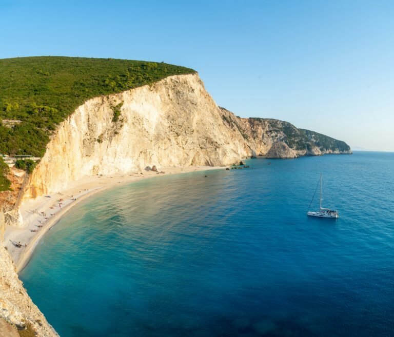 Sailing yacht beside a dramatic Lefkada beach with turquoise Ionian water
