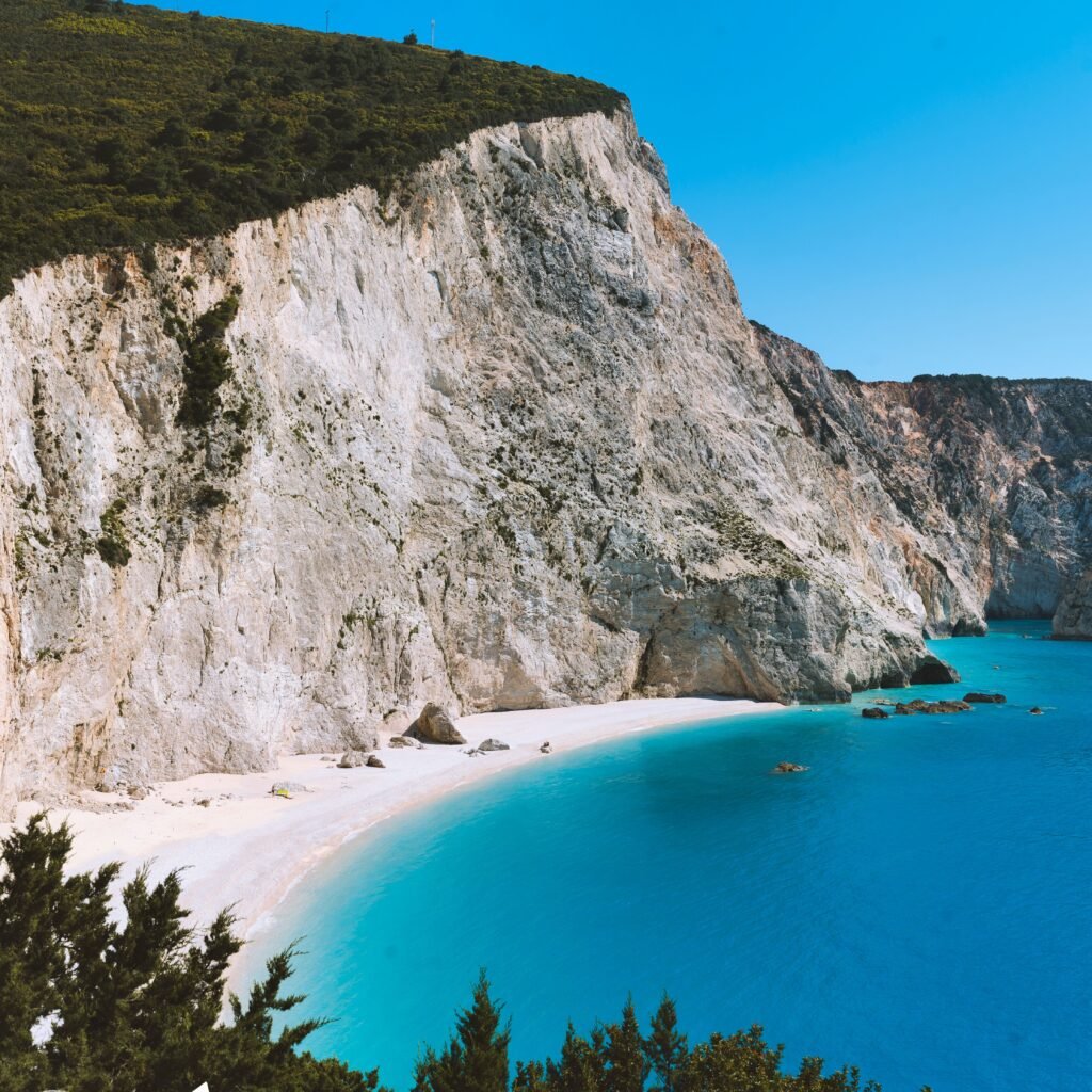 Turquoise Ionian water beneath dramatic cliffs on the west coast of Lefkada