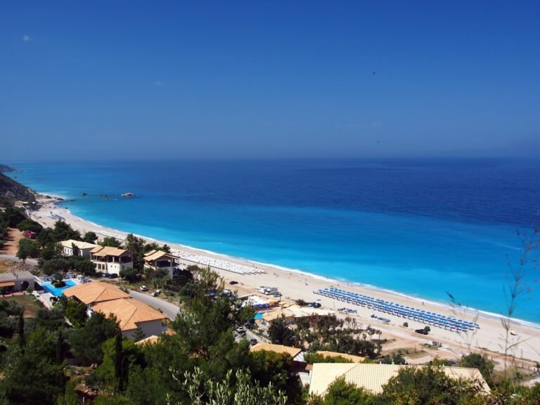 Kathisma’s long shoreline, beach road and turquoise water seen from above