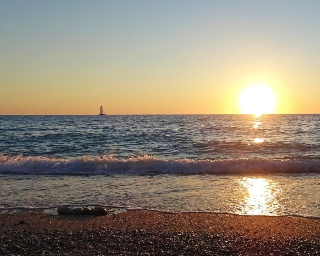Sun setting over the sea from a beach on Lefkada
